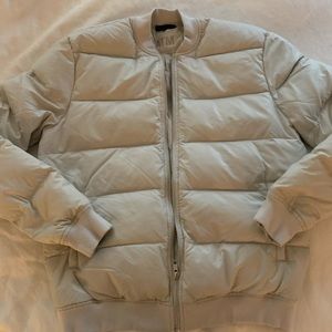 ATM woman’s puffer coat